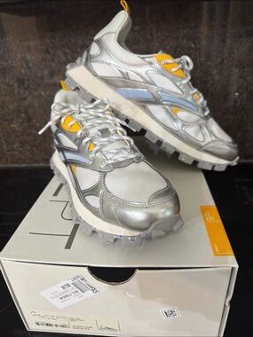 Women’s Metallic Silver Sneakers with Yellow Accents
